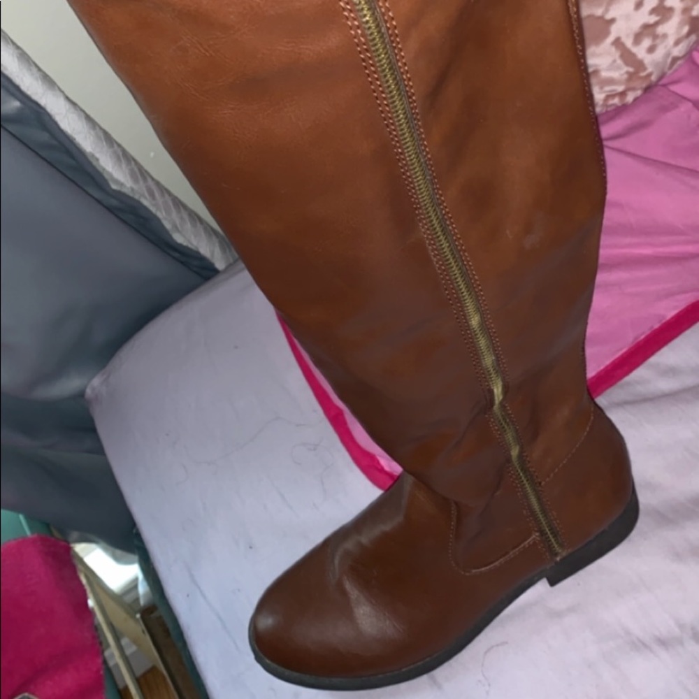 Brown long boots .